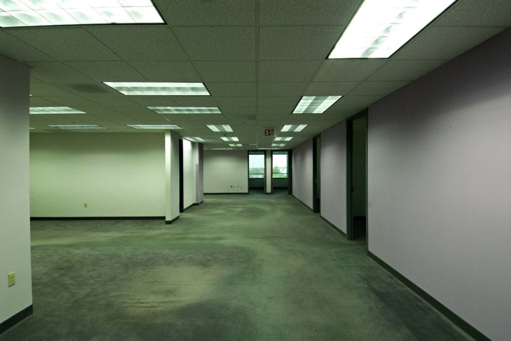 Illustrative library photograph, not an Elbaz project: an empty commercial corridor before refurbishment