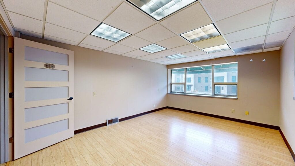 Illustrative library photograph, not an Elbaz project: a vacant modern commercial space with large windows