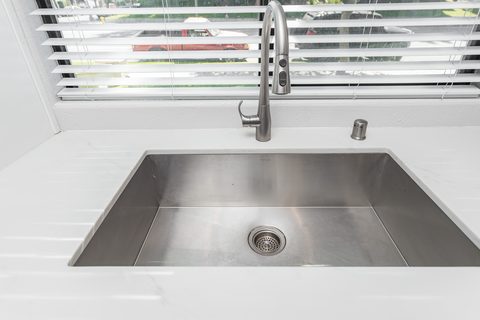 Renovated kitchen with island seating and pendant lighting
