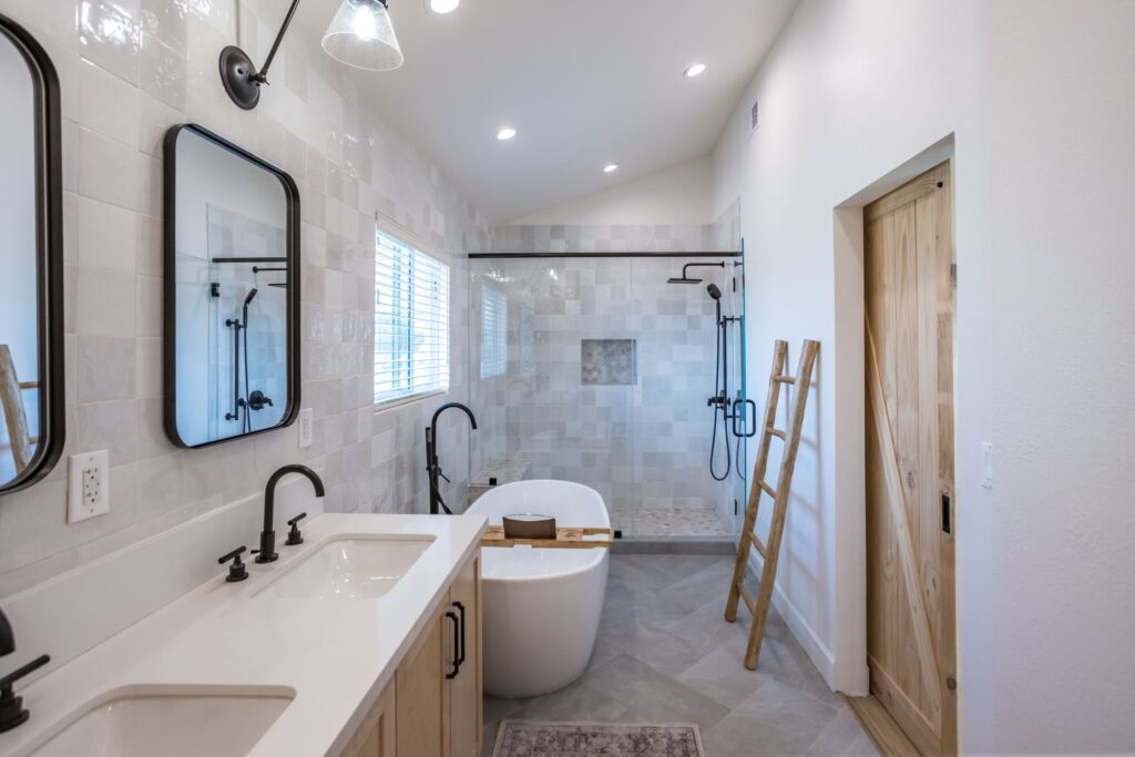 Long view down the primary suite from the vanity to the walk-in shower