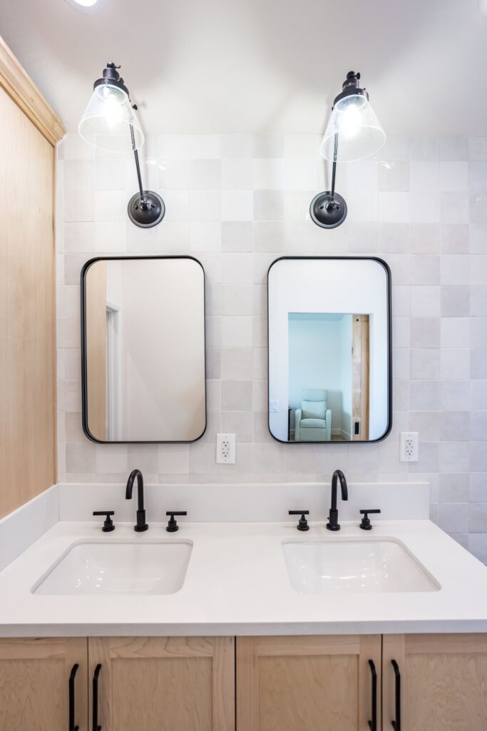 Vanity elevation: light oak drawers, stone top and undermount basins