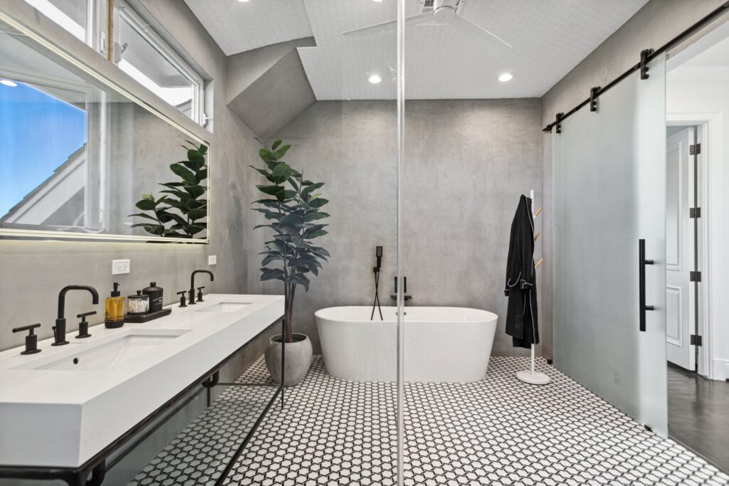 The suite as one room: vanity, tub and shower under the vault