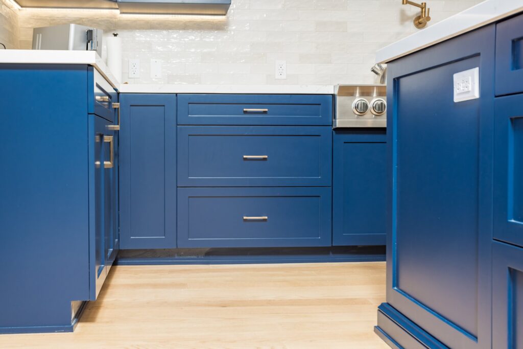 Base cabinet run: shaker drawer fronts, brass hardware and a timber floor