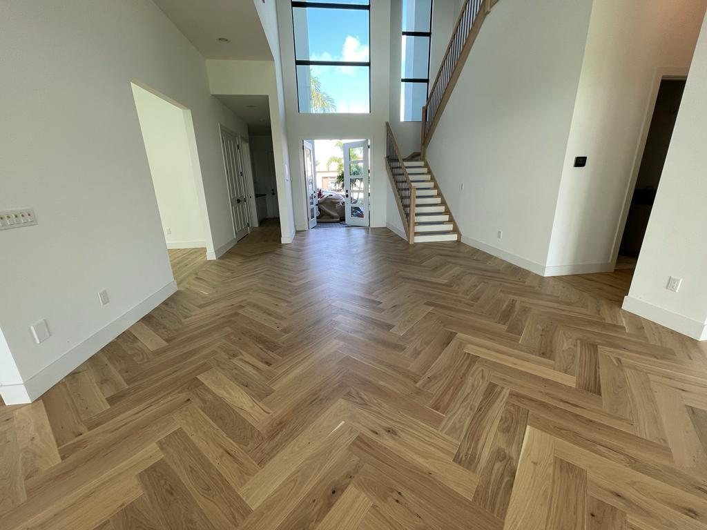Herringbone luxury vinyl plank running through an open living space