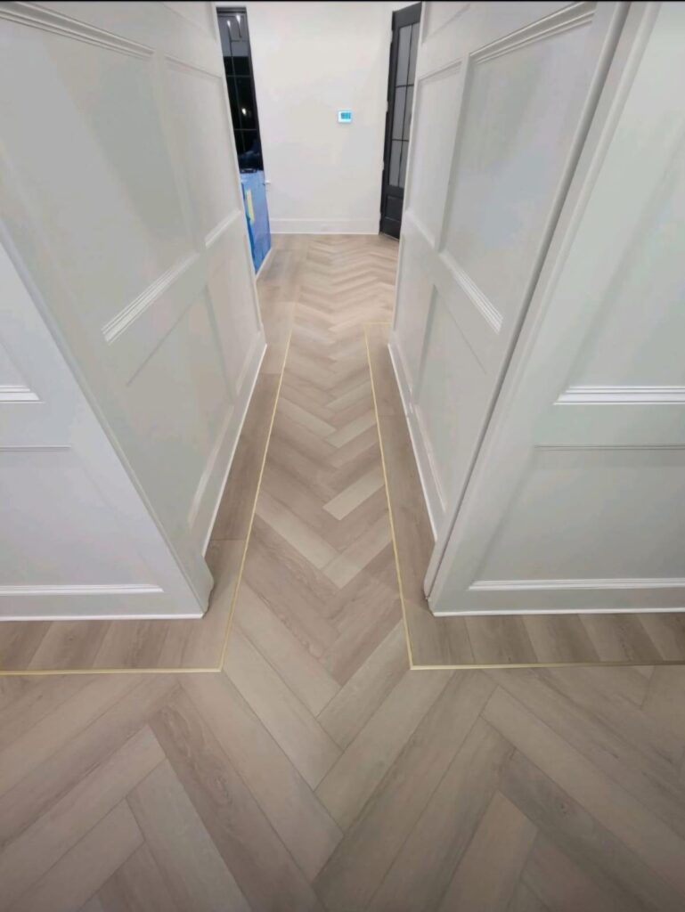 Herringbone plank running past a run of interior doors