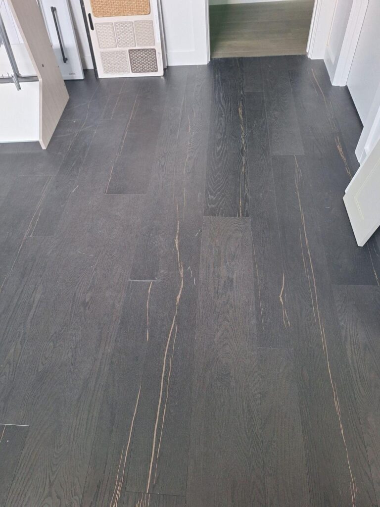 Dark-toned plank with a pronounced grain texture