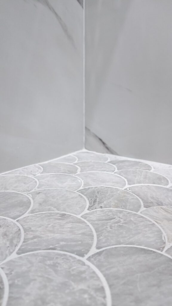 Scallop mosaic shower floor, chosen for grip underfoot