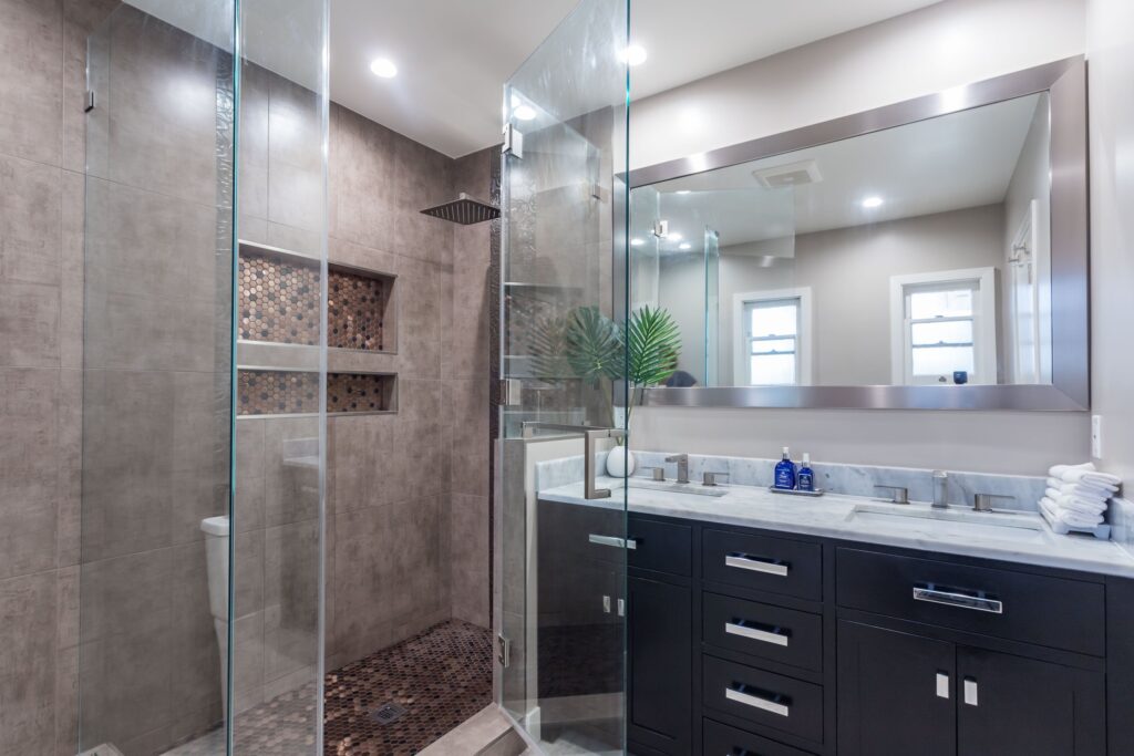The shower alongside a wide double vanity
