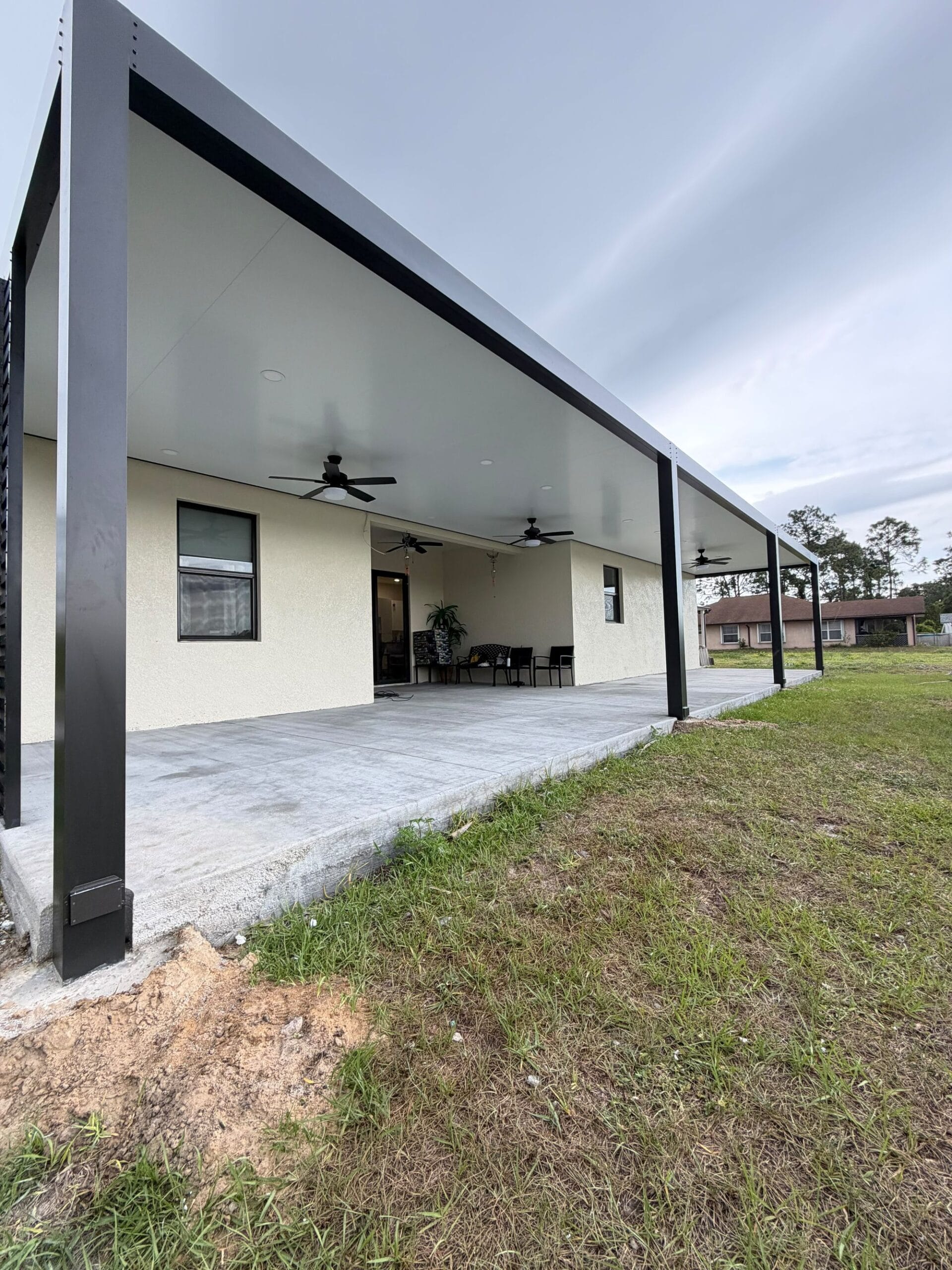 Long covered run with columns installed and the ground still open
