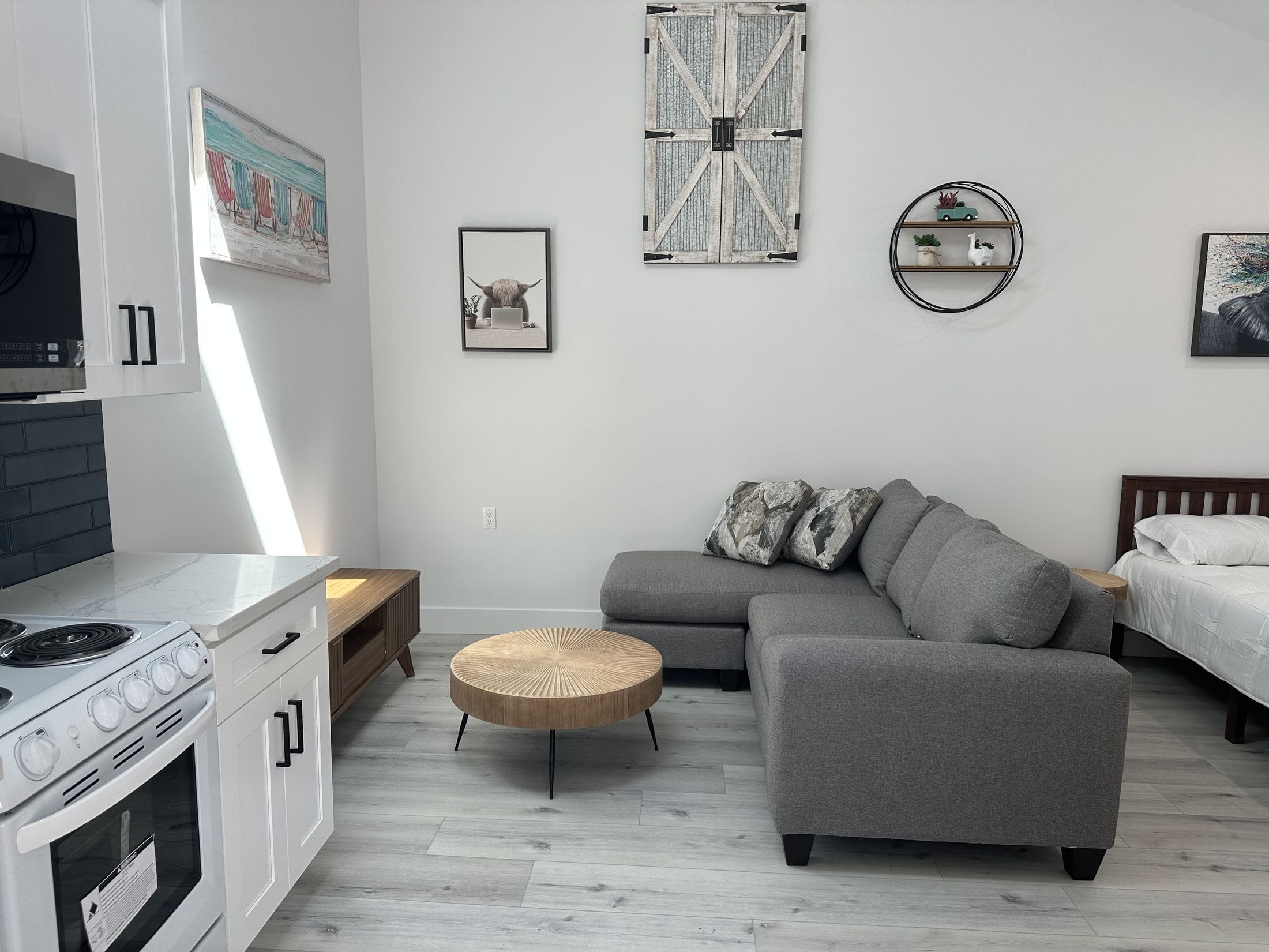 Studio ADU interior showing kitchen, living and sleeping zones
