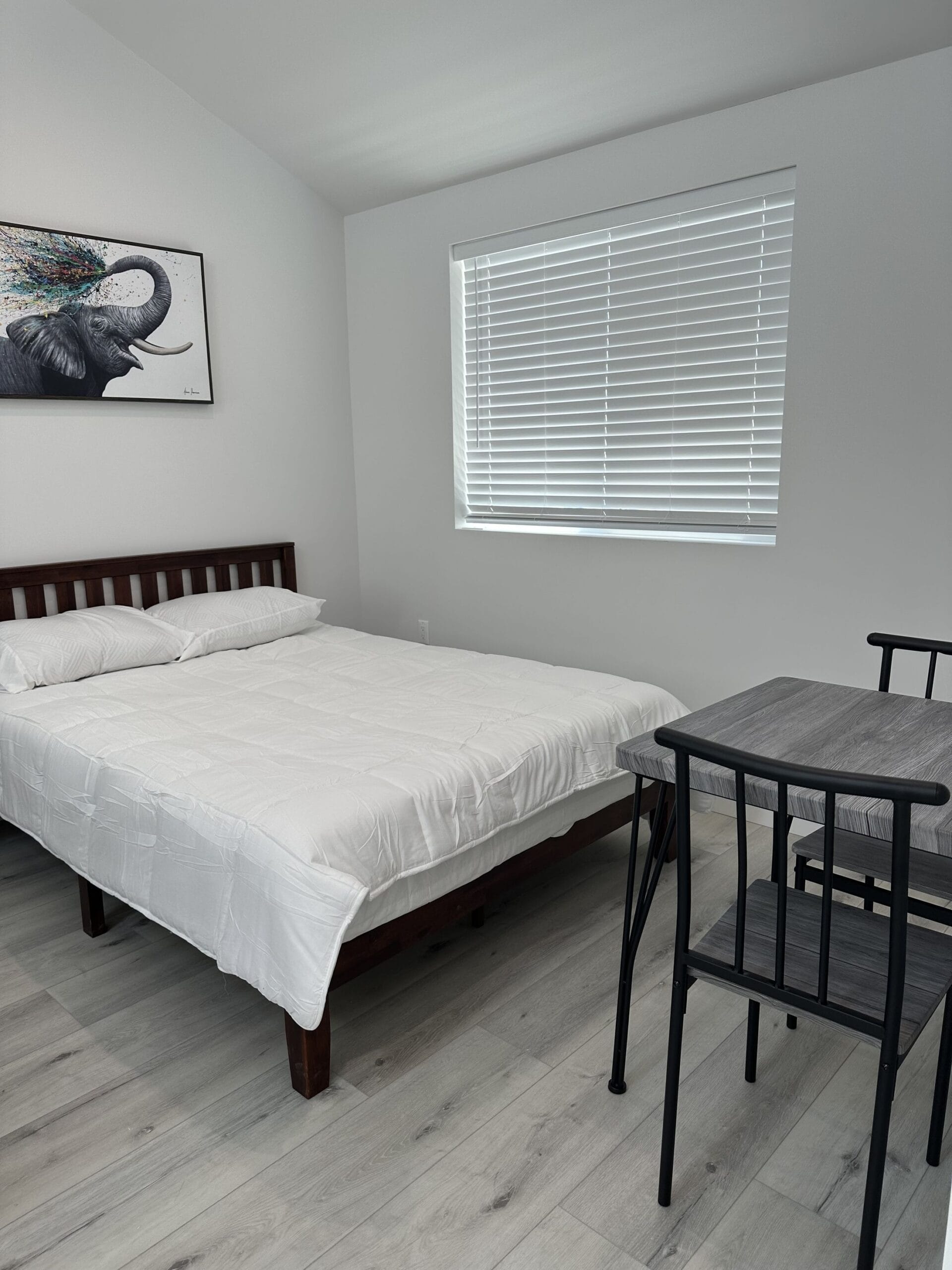 ADU sleeping area with window and bedside table