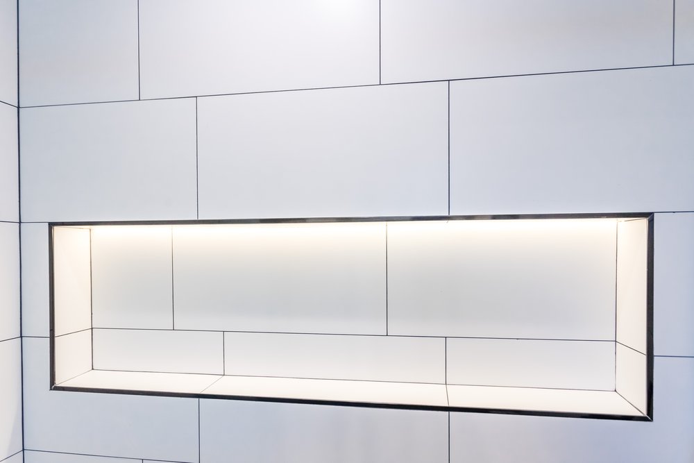 The lit recessed niche square on, set into the large-format wall tile