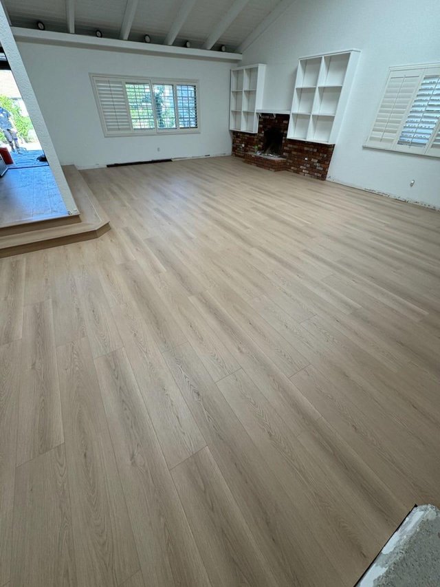 Light plank flooring in a furnished sitting room