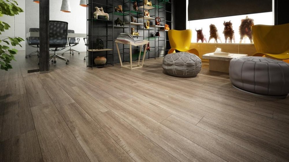 Plank flooring running into a bright open room