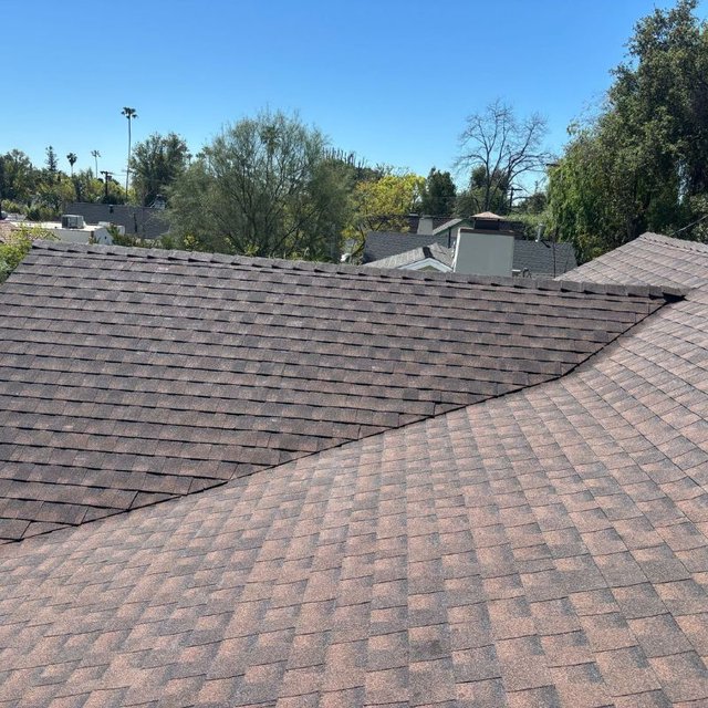 Asphalt shingle roof field with ridge and hip detail
