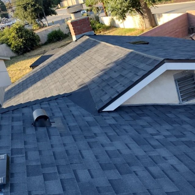 Asphalt shingle roof field with ridge and hip detail