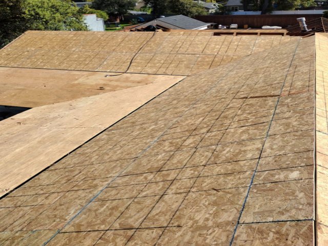 Asphalt shingle roof field with ridge and hip detail