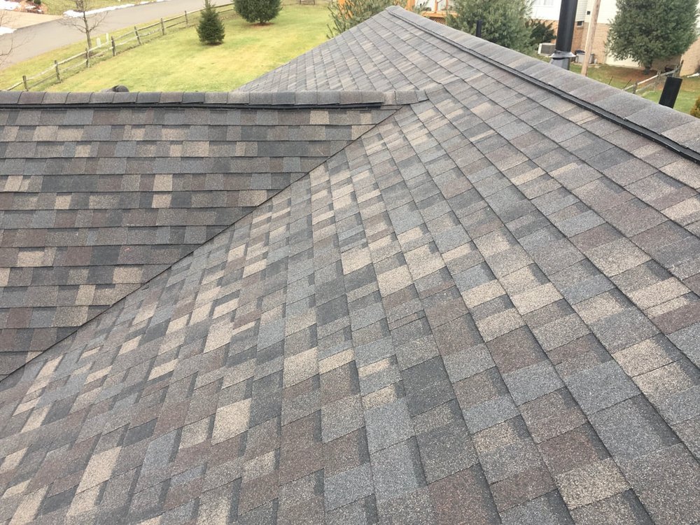 Asphalt shingle roof field with ridge and hip detail