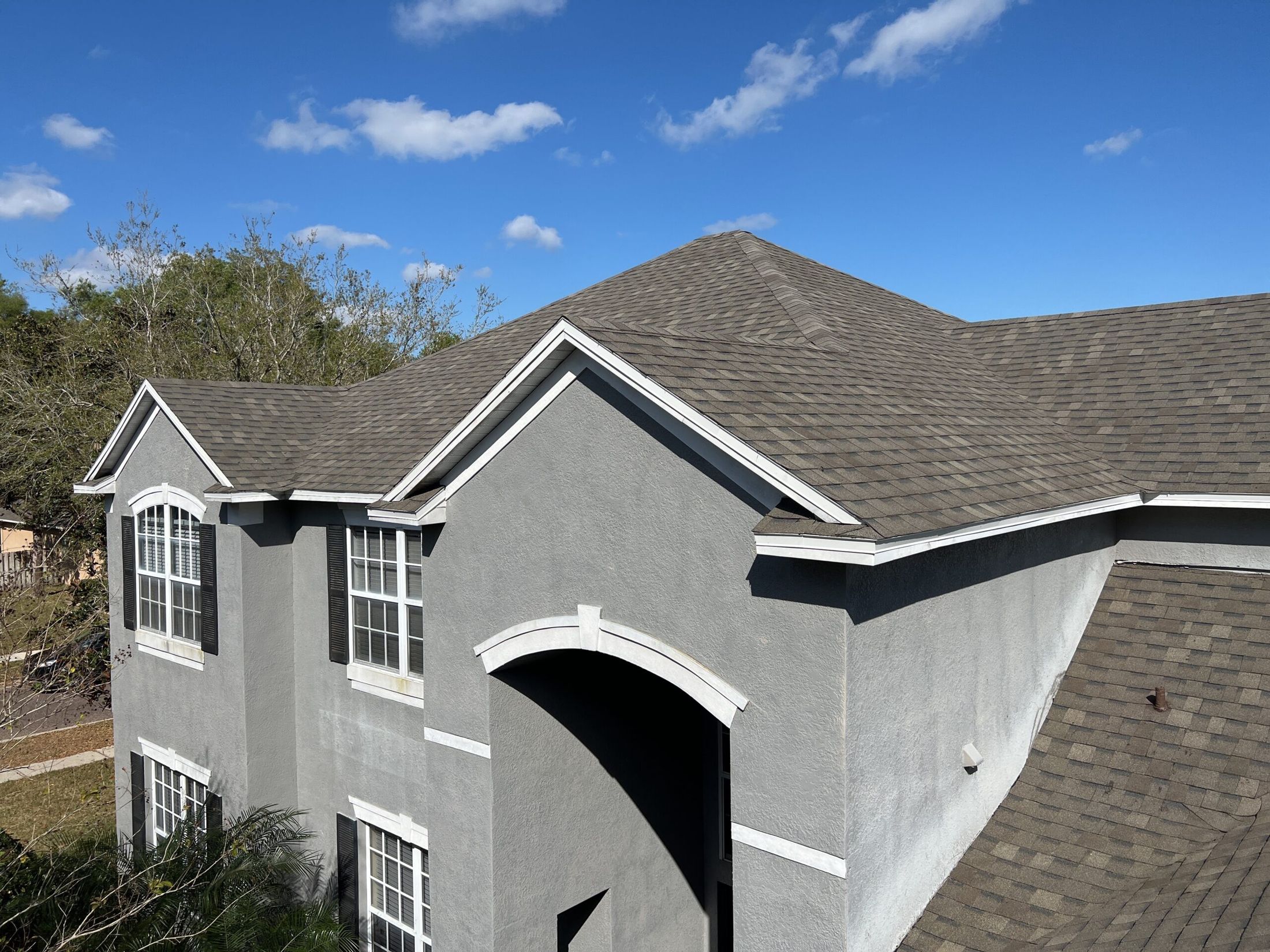 Asphalt shingle roof field with ridge and hip detail