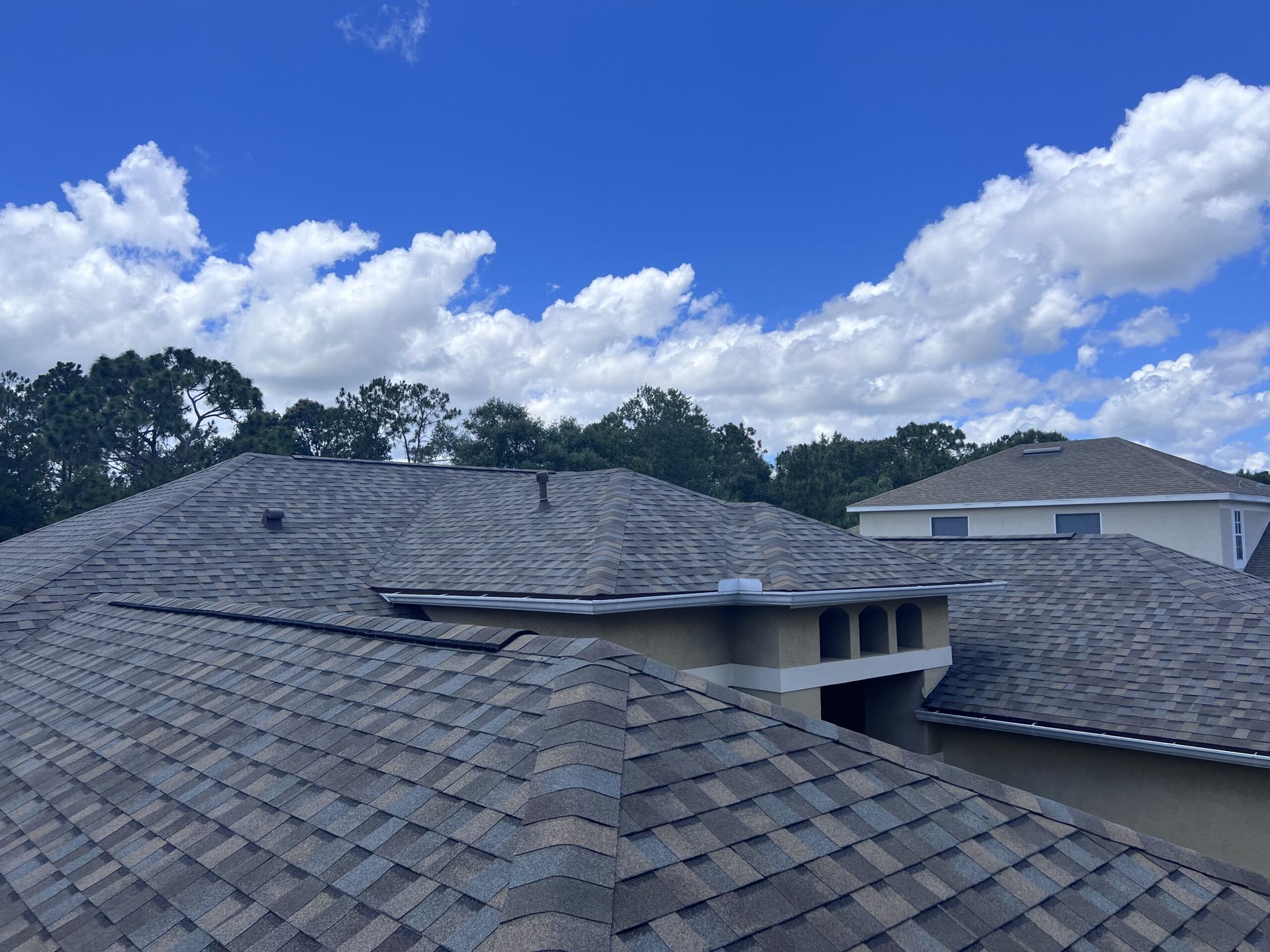 Asphalt shingle roof field with ridge and hip detail
