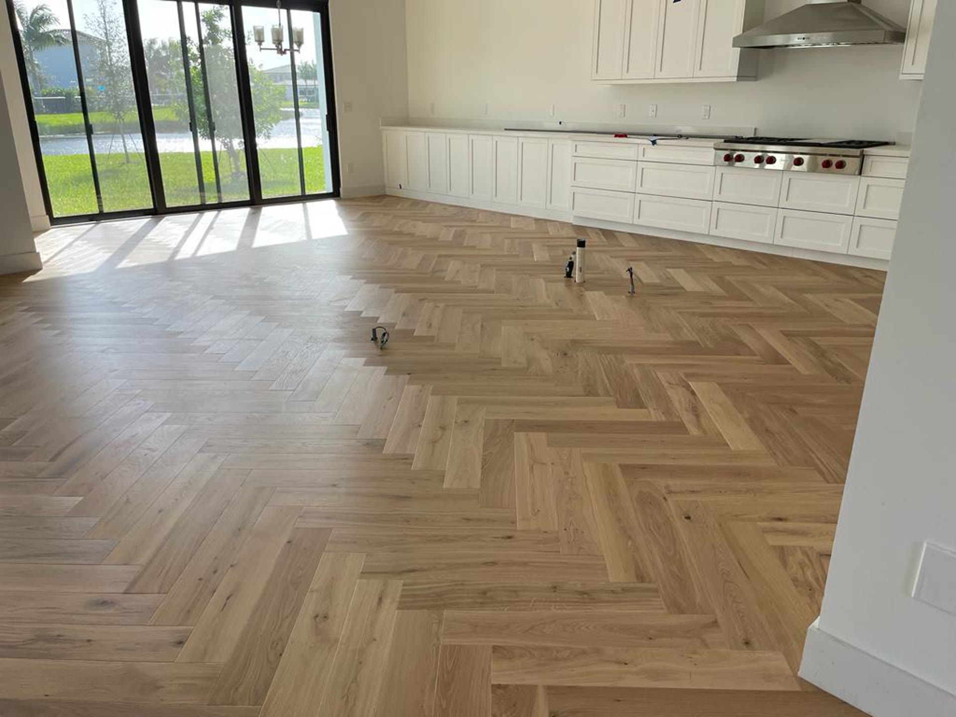 Herringbone flooring laid across a large open span, from the Elbaz Construction library
