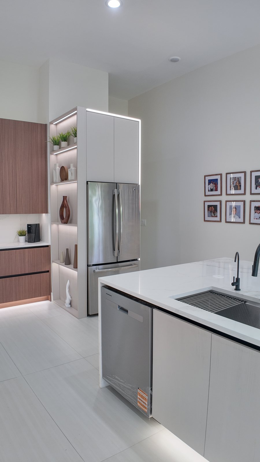 Full-height cabinetry and integrated ovens in a contemporary kitchen