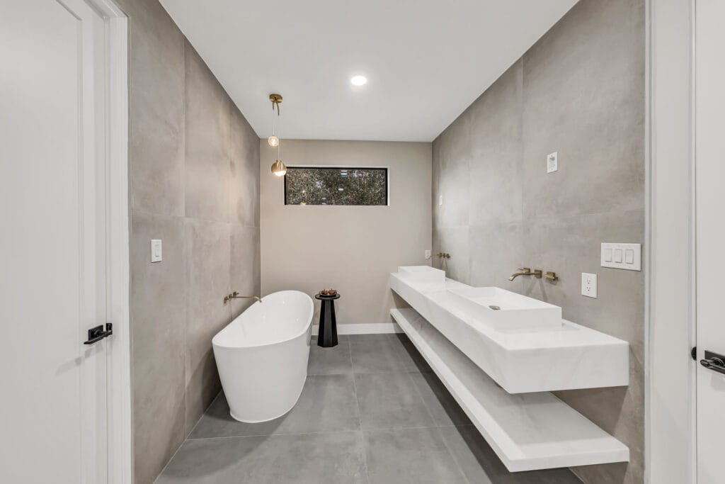 Completed Elbaz Construction bathroom: a freestanding tub with twin floating basins