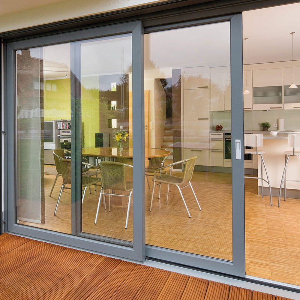 Multi-panel sliding glass door between an interior living space and a timber deck