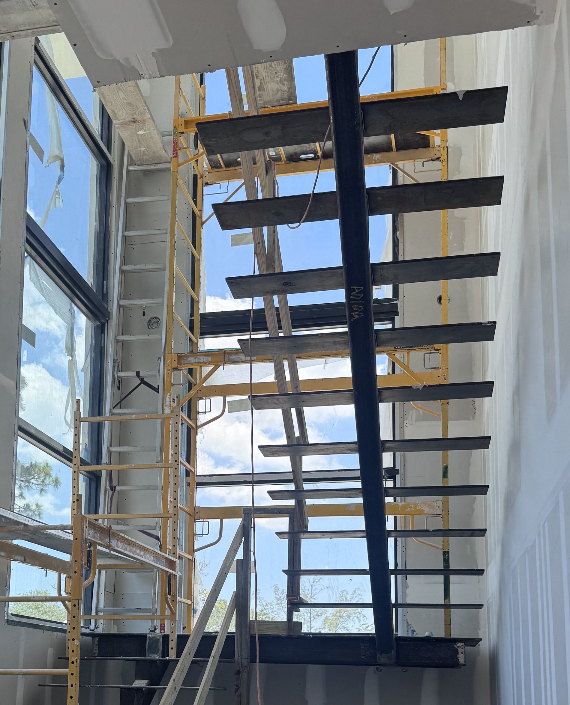 Close-up of the welded steel stair stringer and tread plates before treads and railings are fitted