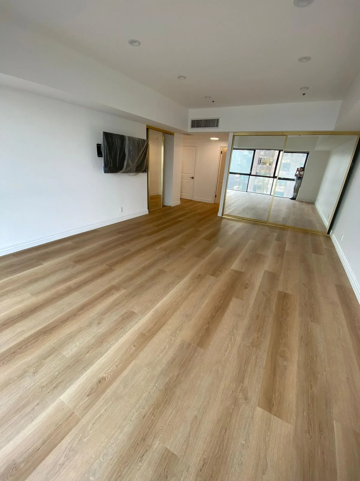 Plank flooring installed across an open living area