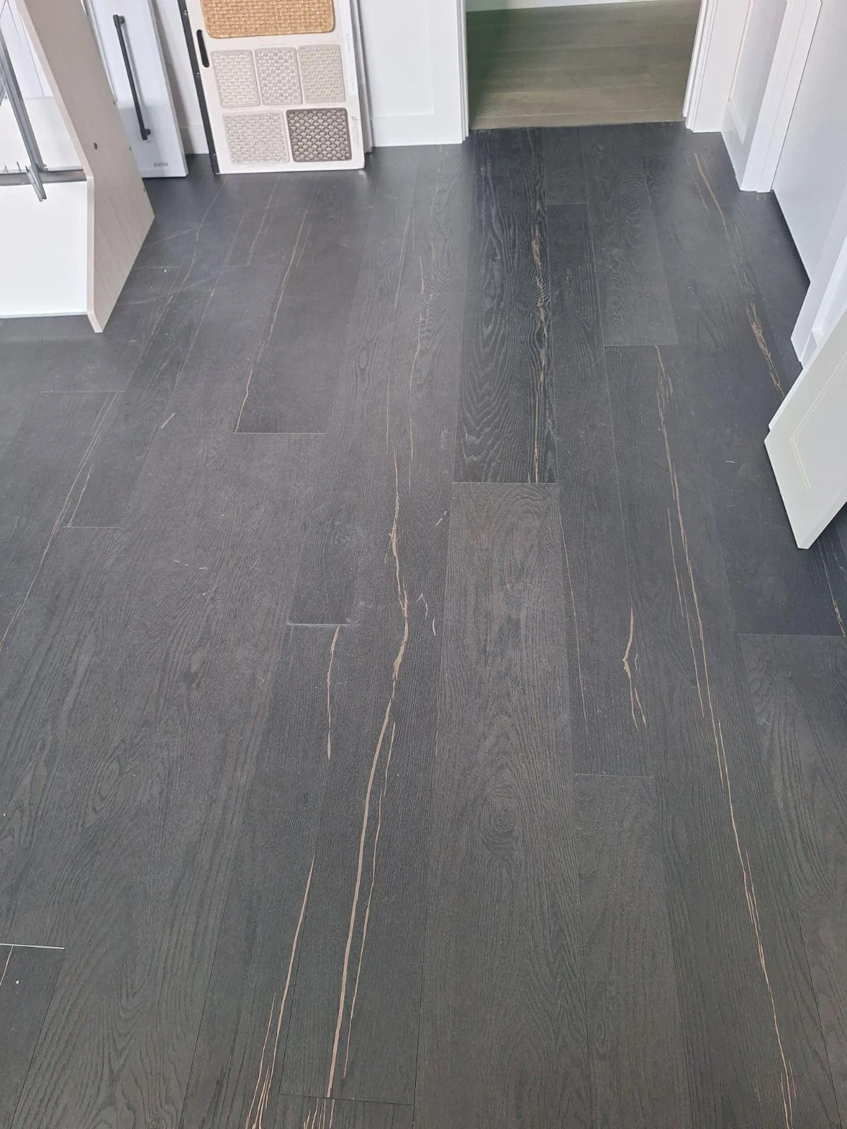 Dark plank flooring installed in a living space