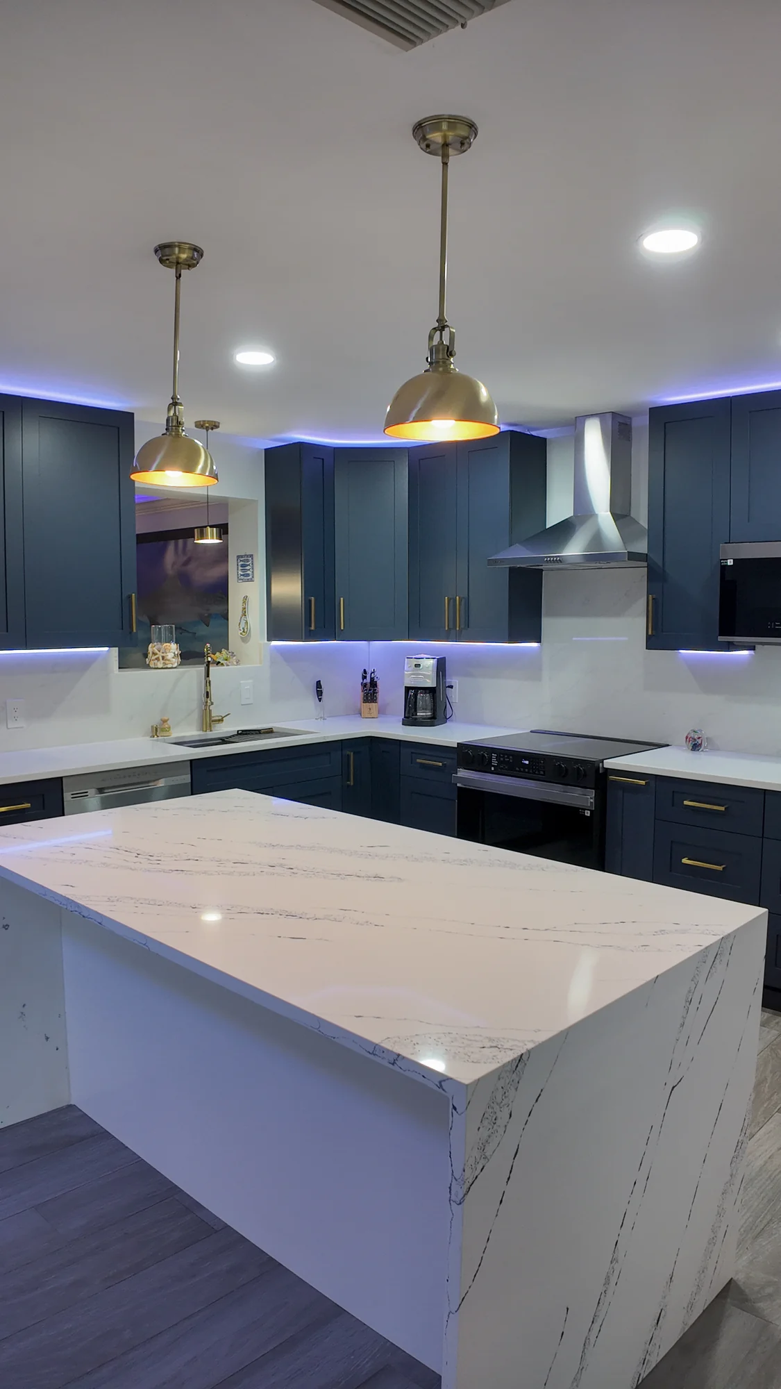 Completed kitchen island and pendant lighting in a South Florida home