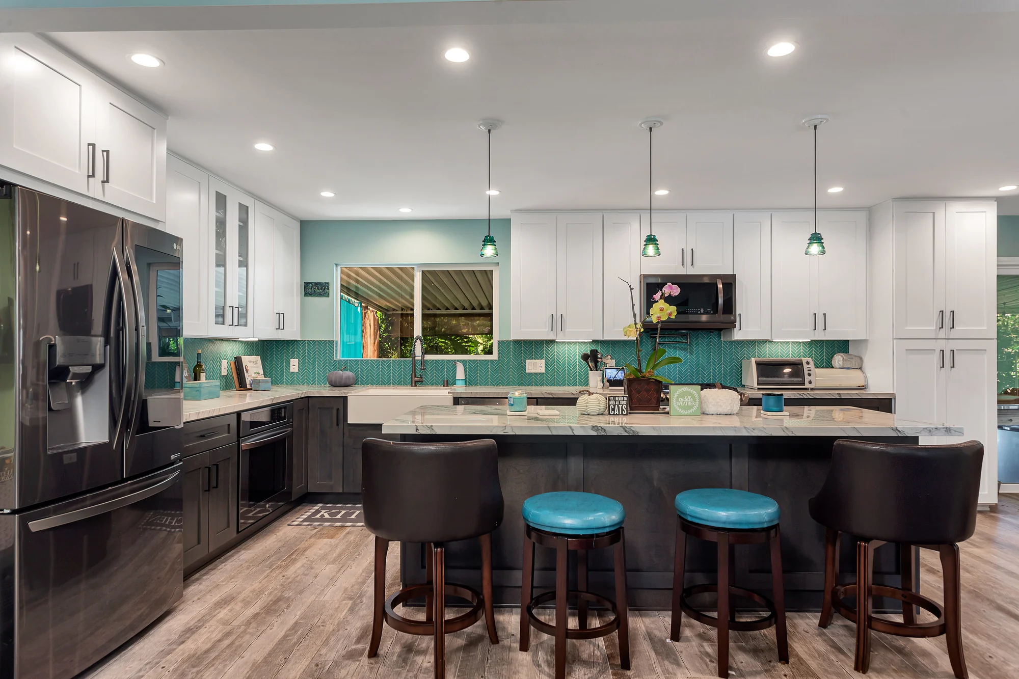 Renovated kitchen island with counter stools