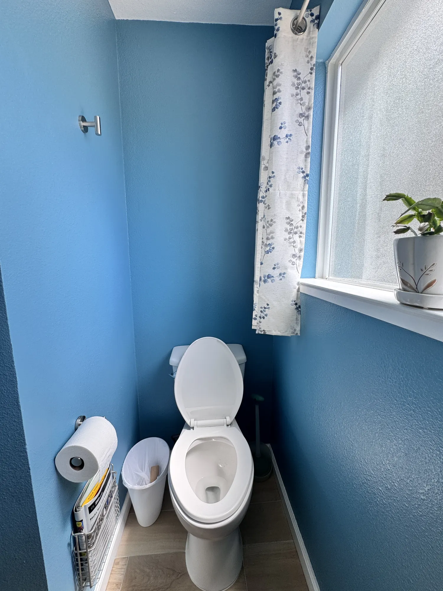Finished bathroom with toilet and painted walls