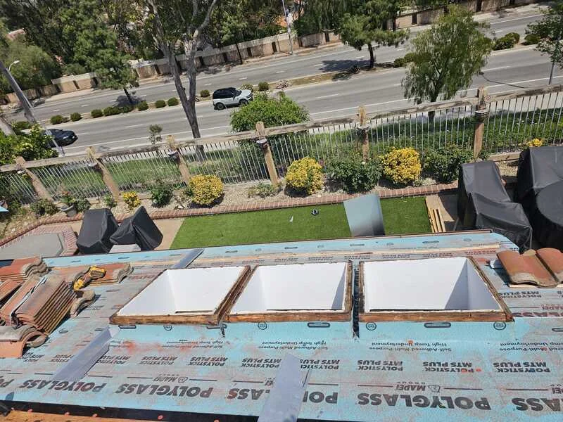 Skylights installed in a completed roof covering