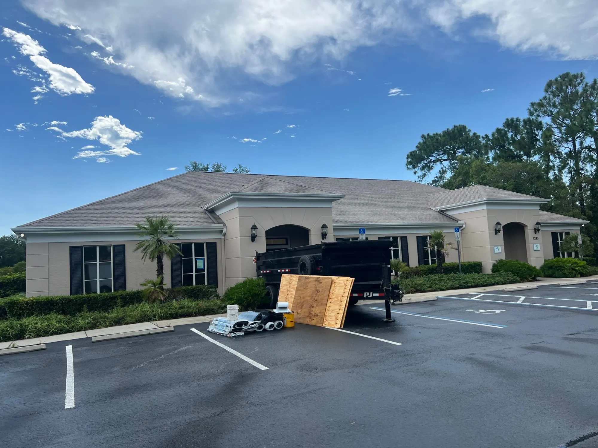 Completed roof on a South Florida home with palms