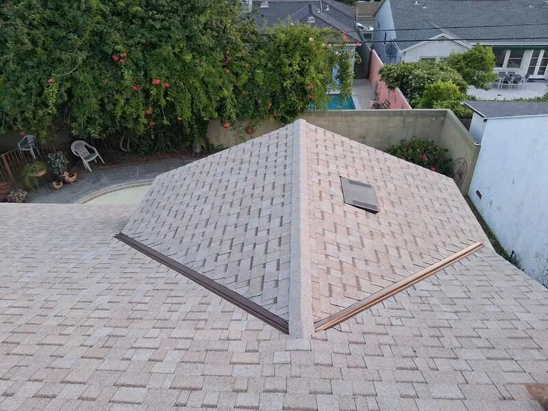 Completed hip roof over a screened pool enclosure