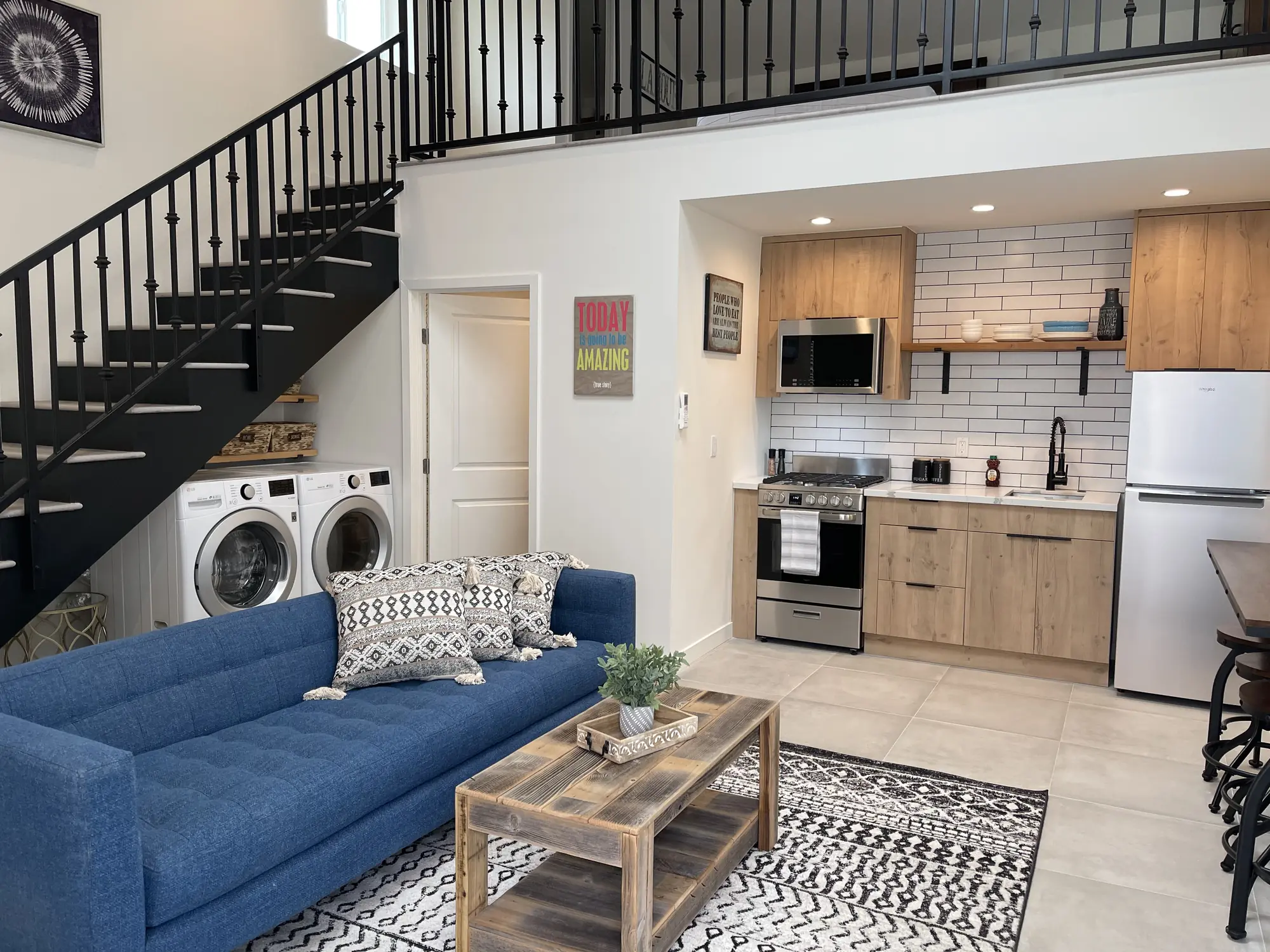 Finished accessory unit with living area, kitchen and laundry