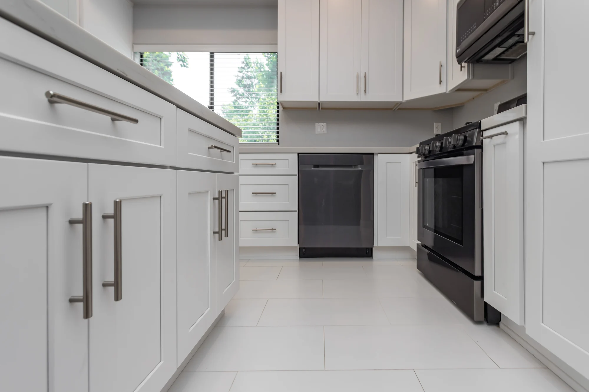 Finished kitchen cabinetry and appliance housing