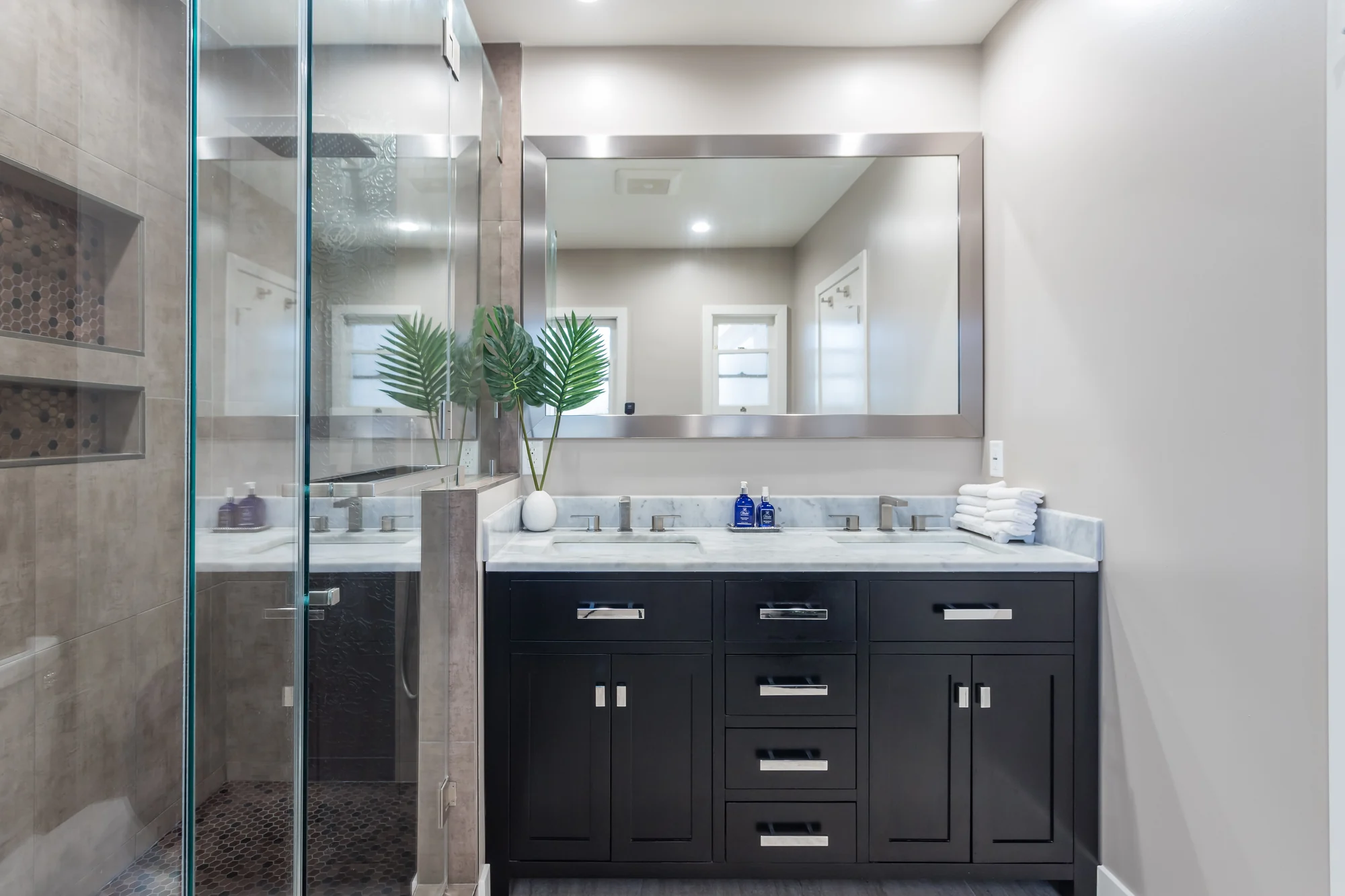 Renovated bathroom double vanity with storage drawers