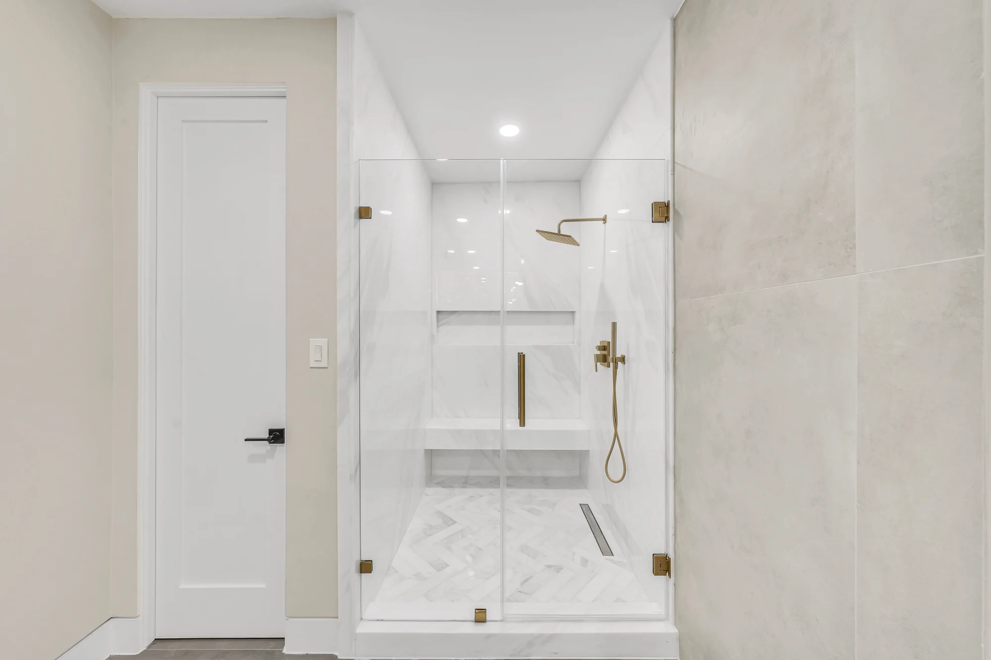 Completed bathroom with shower, toilet and tiled walls