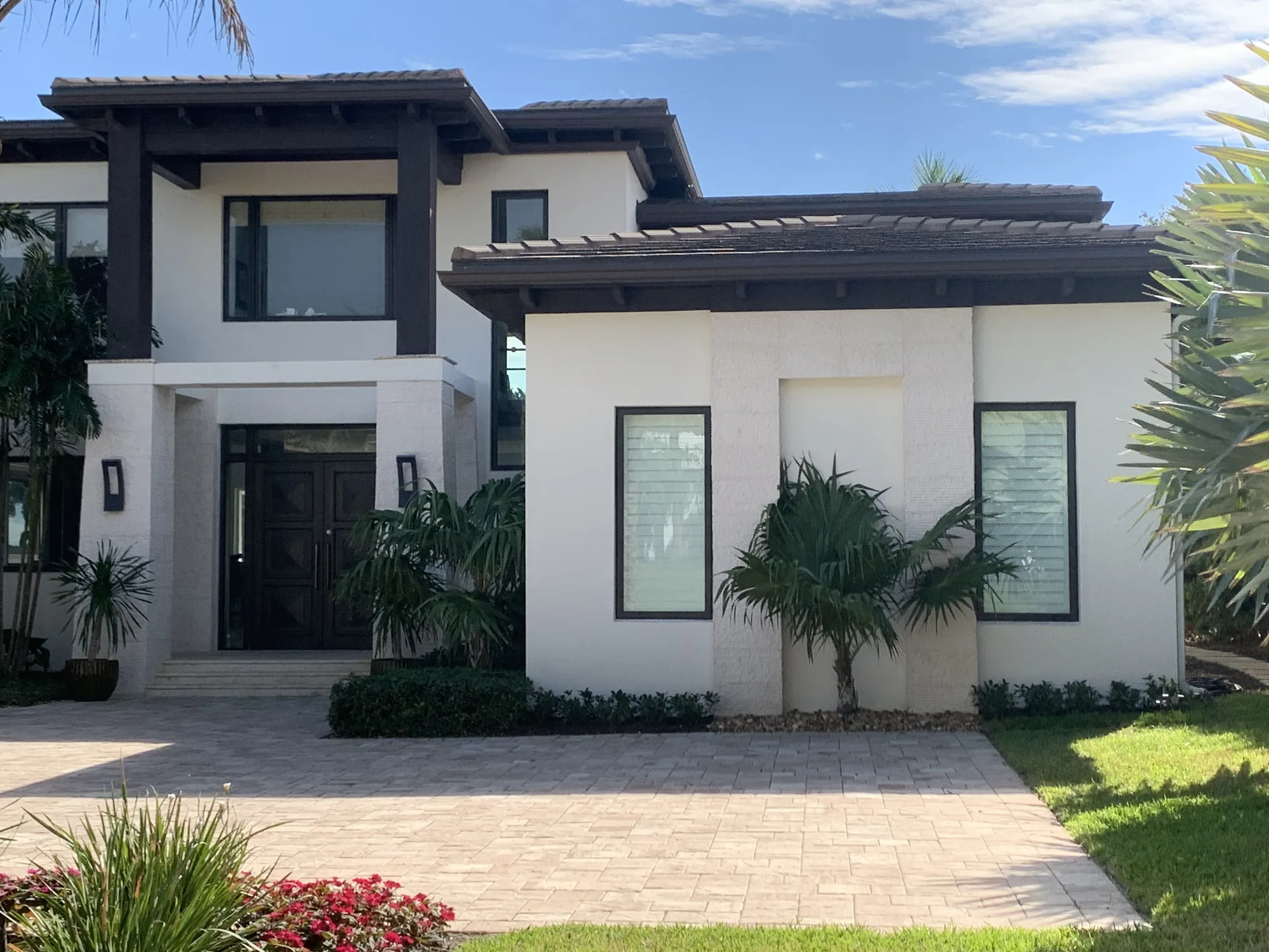 Modern entry and glazing on a two-storey South Florida home