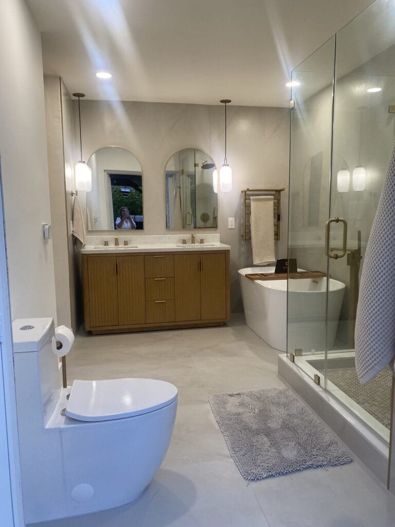 Contemporary Primary Bath Remodel with Fluted Vanity & Freestanding Tub — photo 1