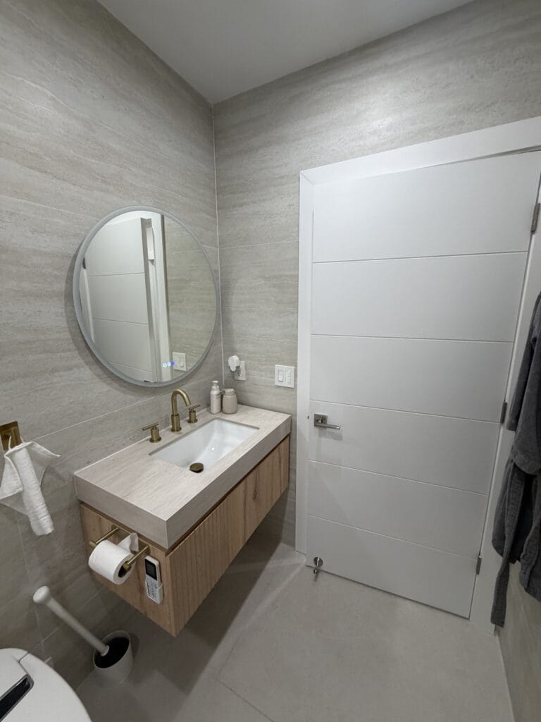 Guest Bathroom Remodel with Frameless Glass Shower and Brass Accents — photo 4