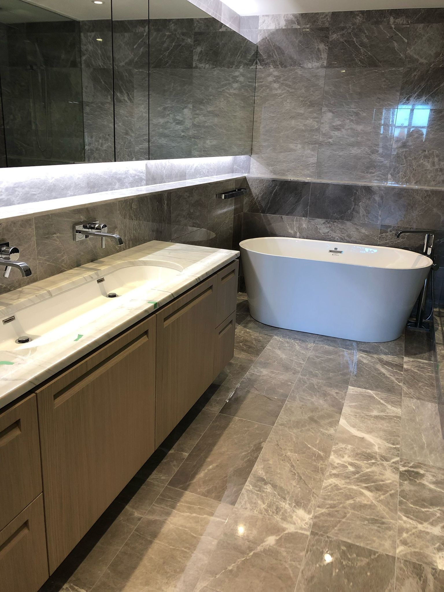 Compact Master Bathroom Remodel with Floating Double Vanity