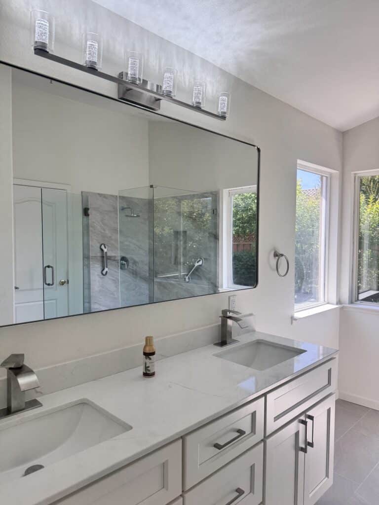 Vaulted-Ceiling Primary Bath Remodel with a Frameless Glass Shower — photo 7