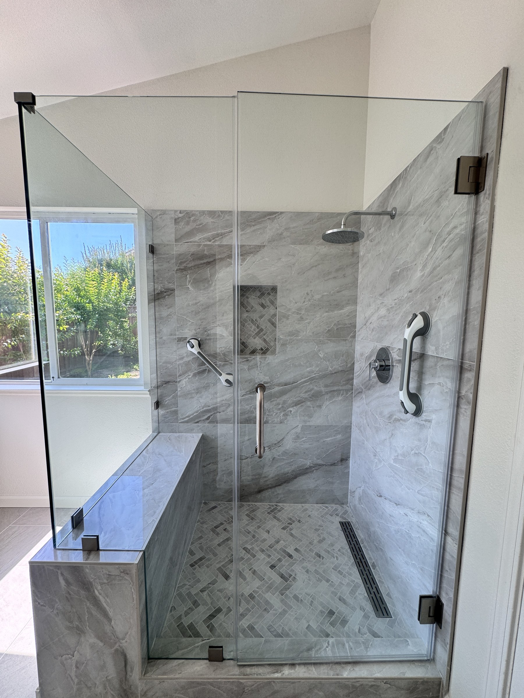 Vaulted-Ceiling Primary Bath Remodel with a Frameless Glass Shower