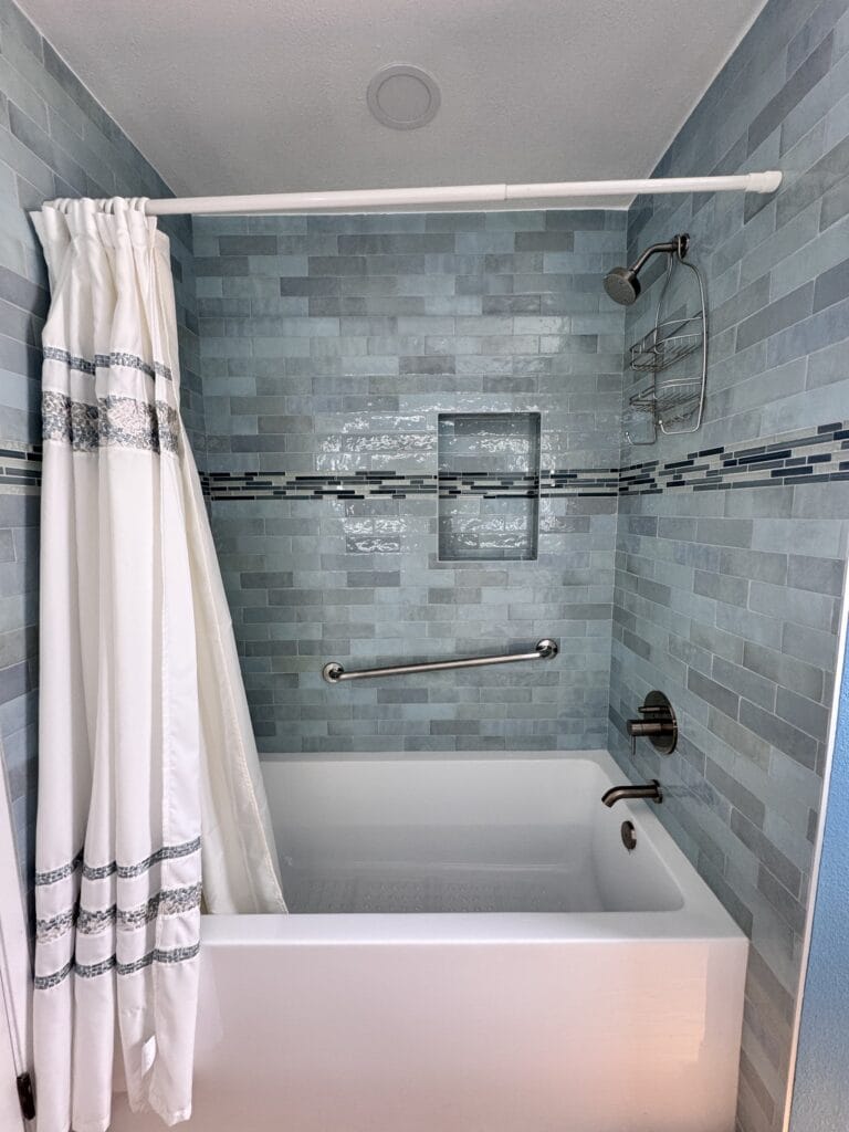 Sea-Glass Glazed Tile Bathroom Remodel with Double Vanity