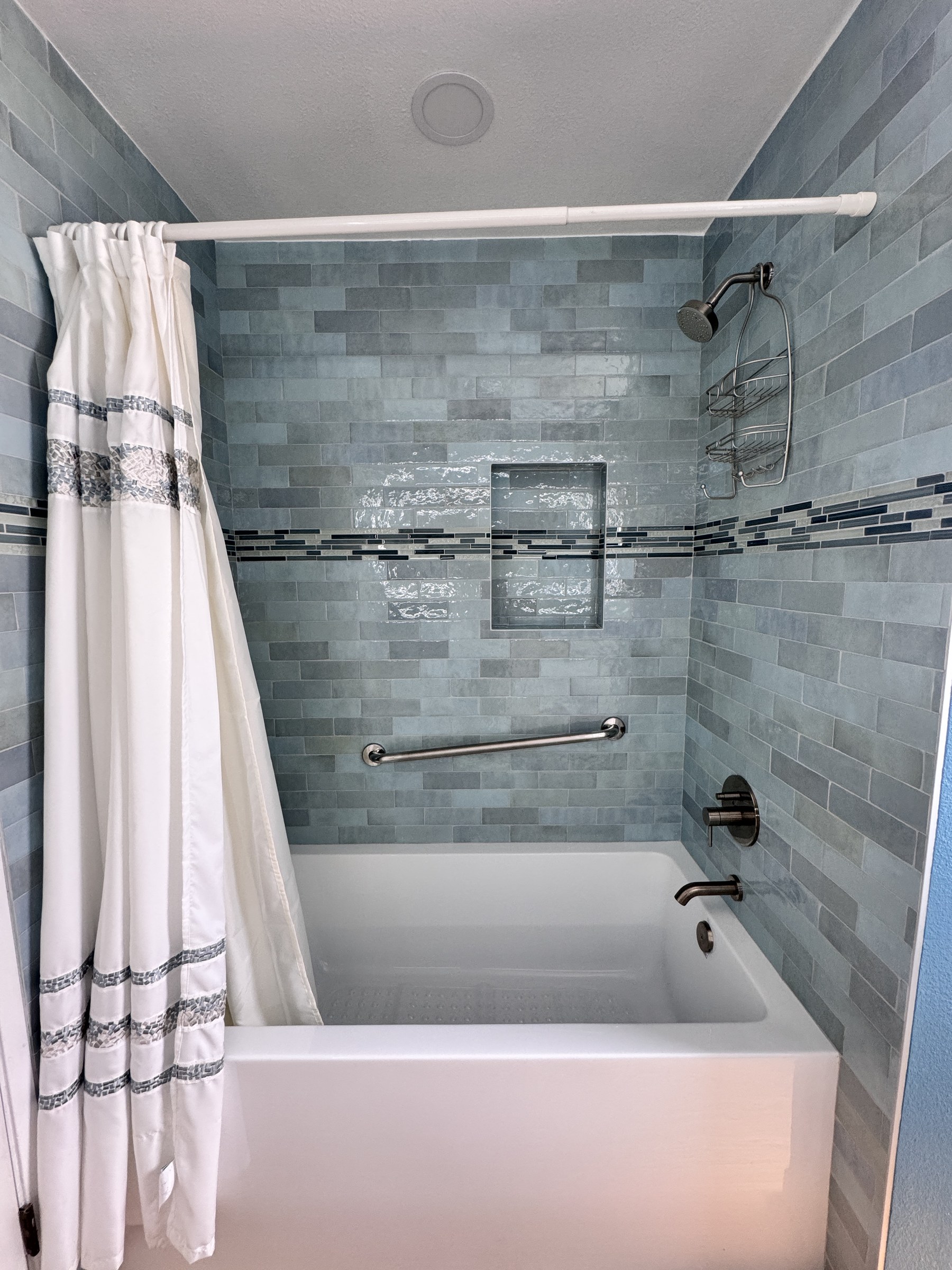 Sea-Glass Glazed Tile Bathroom Remodel with Double Vanity
