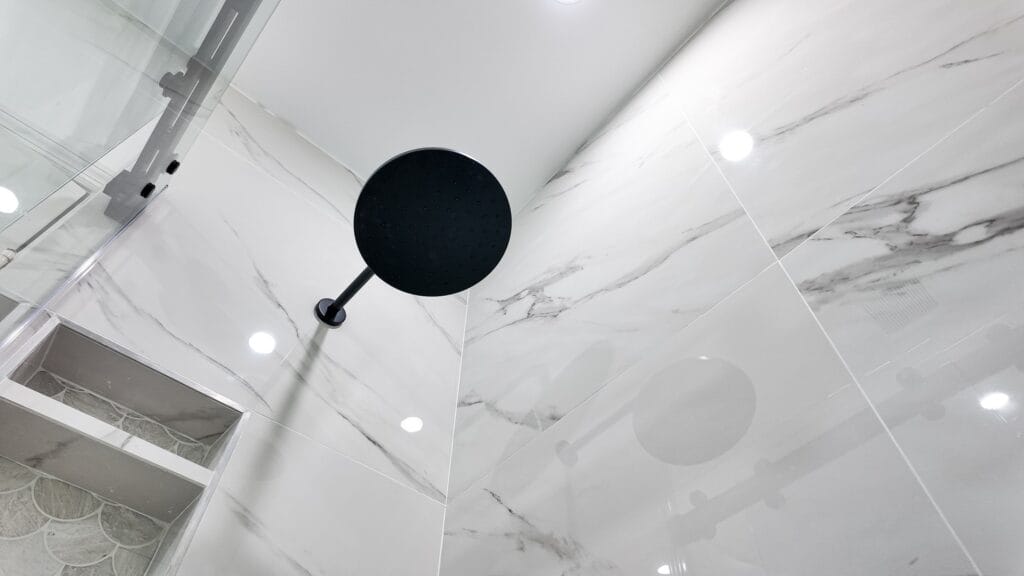 Spa-Style Walk-In Shower Bathroom Remodel with Matte Black Fixtures — photo 13